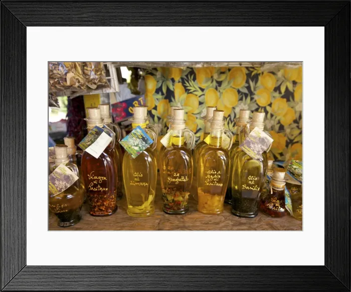 Framed Print : Olive oil for sale on market stall near Positano, Amalfi Coast road, Campania Framed Print : Olive oil for sale on market stall near Positano, Amalfi Coast road, Campania