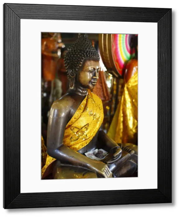 Framed Print : Buddha statue with offerings at Wat Phnom temple, Phnom Penh, Cambodia Framed Print : Buddha statue with offerings at Wat Phnom temple, Phnom Penh, Cambodia