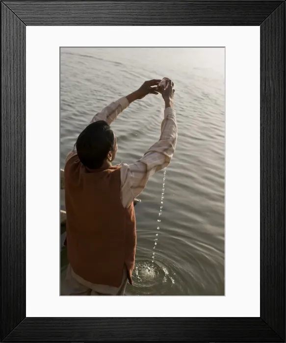 Framed Print : Hindu performing his daily devotion ritual to Ganga in Varanasi, Uttar Pradesh Framed Print : Hindu performing his daily devotion ritual to Ganga in Varanasi, Uttar Pradesh
