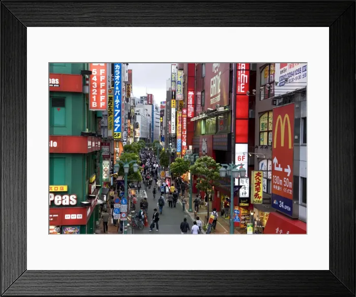Framed Print : A pedestrian street lined with shops and signboards attracts a crowd in Shinjuku Framed Print : A pedestrian street lined with shops and signboards attracts a crowd in Shinjuku