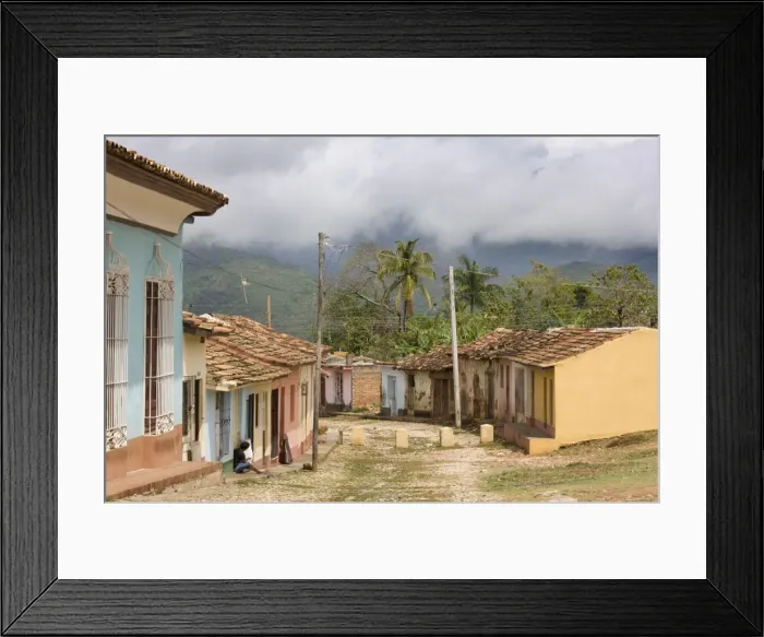 Framed Print : View along old street against backdrop of cloud-covered hills after heavy rainfall Framed Print : View along old street against backdrop of cloud-covered hills after heavy rainfall