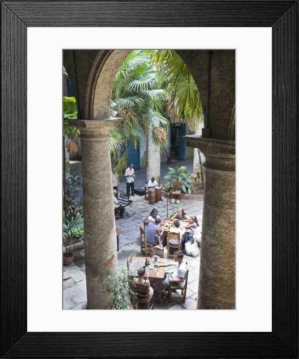 Framed Print : People sitting at tables and musicians playing in courtyard of colonial building built in 1780 Framed Print : People sitting at tables and musicians playing in courtyard of colonial building built in 1780