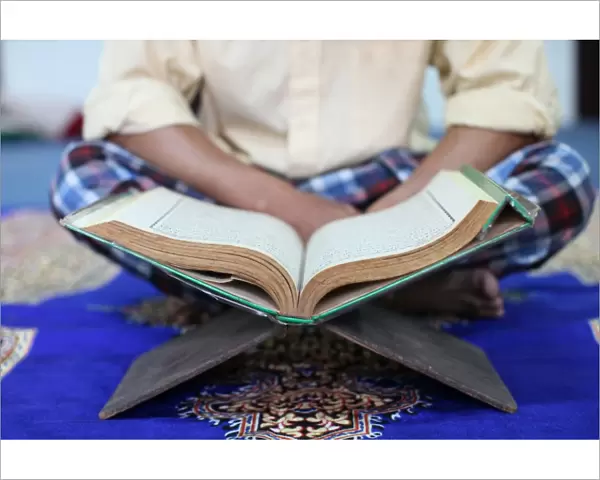Muslim man reading the Quran in mosque, Ho Chi Minh City, Vietnam, Indochina