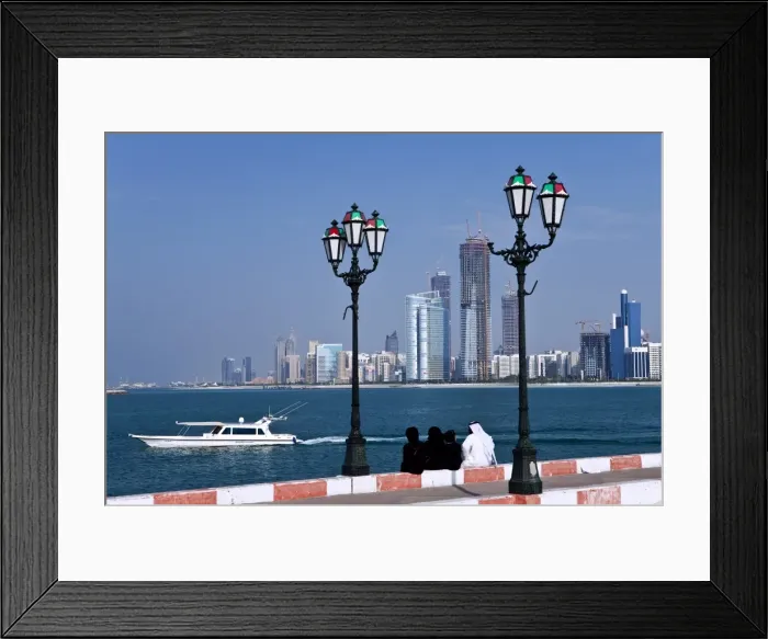 Framed Print : City skyline and the famous Corniche looking across the harbour from a pier