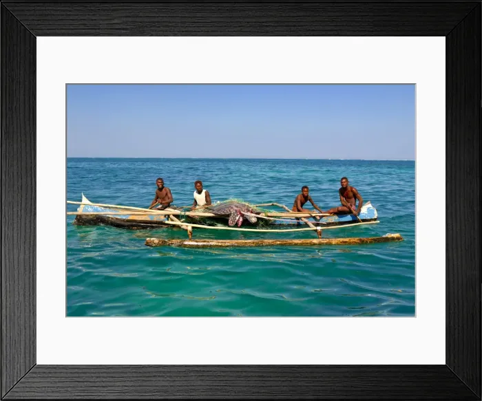 Framed Print : Traditional rowing boat in the turquoise water of the Indian Ocean, Madagascar, Africa Framed Print : Traditional rowing boat in the turquoise water of the Indian Ocean, Madagascar, Africa