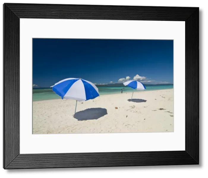 Framed Print : Parasols at the beautiful beach in Nosy Iranja, a little island near Nosy Be Framed Print : Parasols at the beautiful beach in Nosy Iranja, a little island near Nosy Be
