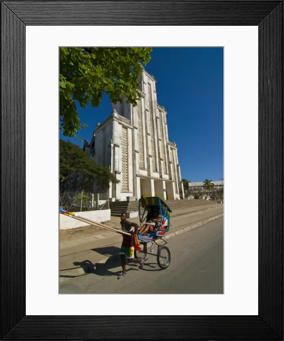 Framed Print : Man with a rickshaw in front of a modern church in Mahajanga, Madagascar, Africa Framed Print : Man with a rickshaw in front of a modern church in Mahajanga, Madagascar, Africa