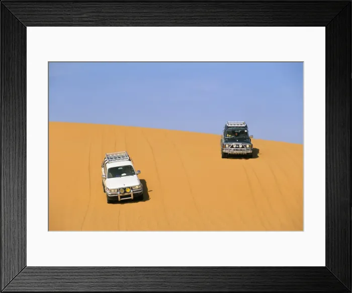 Framed Print : Jeeps on sand dune, Akakus, Sahara desert, Fezzan, Libya, North Africa. Africa Framed Print : Jeeps on sand dune, Akakus, Sahara desert, Fezzan, Libya, North Africa. Africa