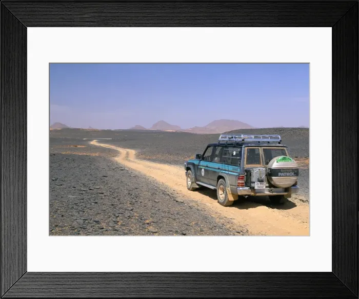 Framed Print : Jeep driving on stone desert, Akakus, Sahara desert, Fezzan, Libya, North Africa, Africa Framed Print : Jeep driving on stone desert, Akakus, Sahara desert, Fezzan, Libya, North Africa, Africa