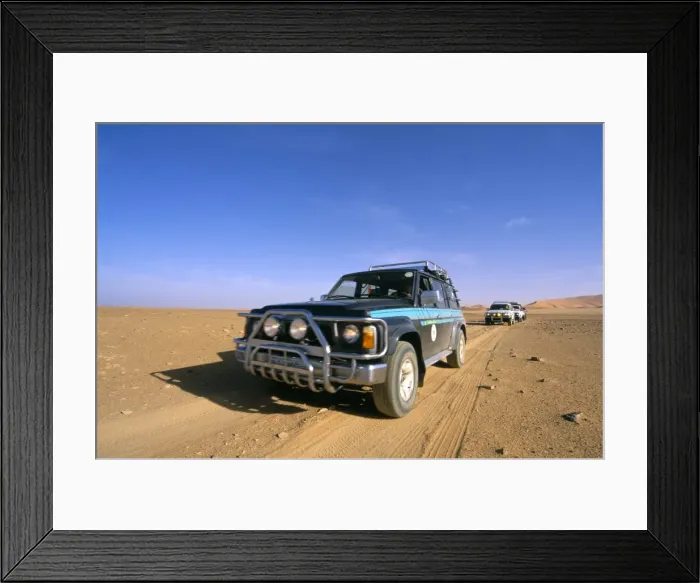 Framed Print : Jeeps driving through desert, Erg Murzuq, Sahara desert, Fezzan, Libya Framed Print : Jeeps driving through desert, Erg Murzuq, Sahara desert, Fezzan, Libya