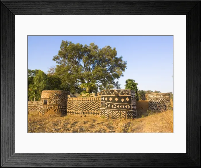 Framed Print : Geometric designs painted on traditional houses in small village in Tiebele area of Burkina Faso Framed Print : Geometric designs painted on traditional houses in small village in Tiebele area of Burkina Faso
