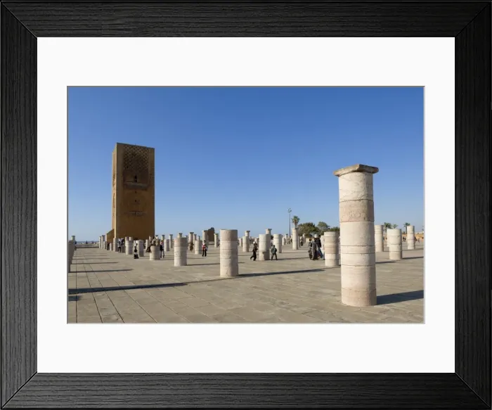 Framed Print : Visitors walk among the prayer hall columns of The Unfinished Hassan Mosque Framed Print : Visitors walk among the prayer hall columns of The Unfinished Hassan Mosque