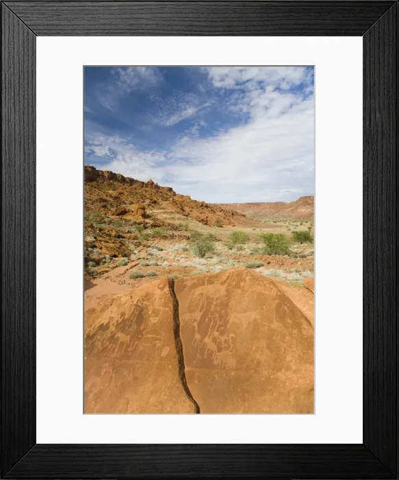 Framed Print : Ancient drawings (petroglyphs) on sandstone rock, dating back 6000 years to the early stone age Framed Print : Ancient drawings (petroglyphs) on sandstone rock, dating back 6000 years to the early stone age