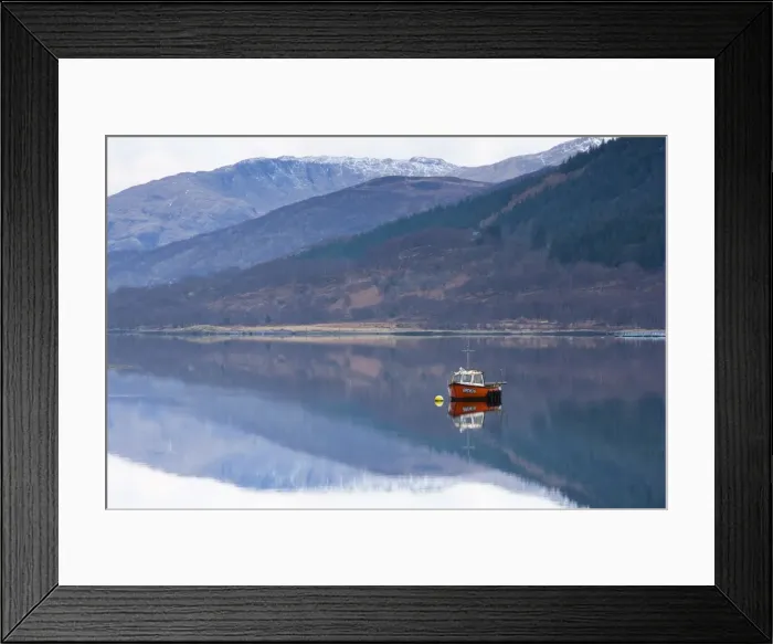 Framed Print : Flat calm Loch Levan with reflections of snow-capped mountains and small red fishing boat Framed Print : Flat calm Loch Levan with reflections of snow-capped mountains and small red fishing boat