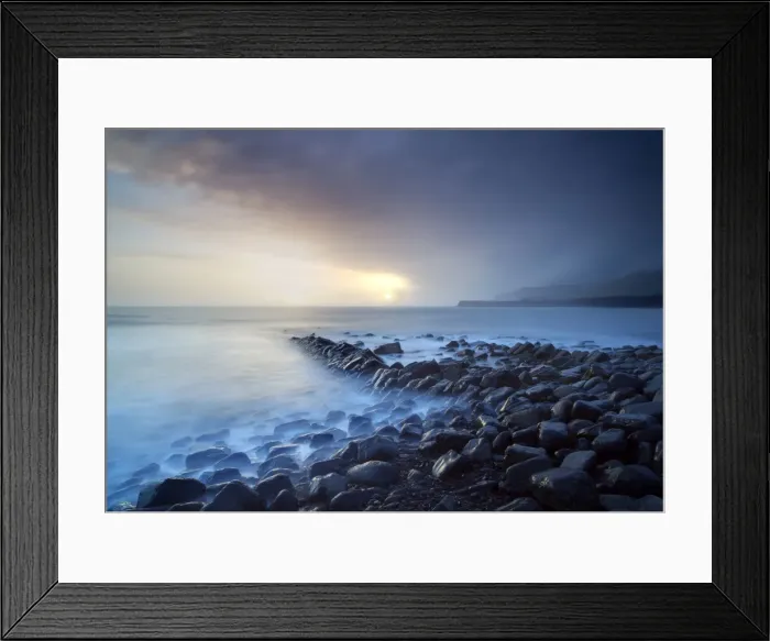 Framed Print : Sunset on a stormy winters day looking across Kimmeridge Bay from the remains of Clavells Pier, Kimmeridge, near Swanage, Dorset, England, United Framed Print : Sunset on a stormy winters day looking across Kimmeridge Bay from the remains of Clavells Pier, Kimmeridge, near Swanage, Dorset, England, United
