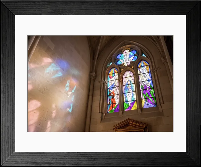 Framed Print : Modern stained glass window casting light on a wall in Catedral de Santa Maria la Real de la Almudena, Madrid, Spain Framed Print : Modern stained glass window casting light on a wall in Catedral de Santa Maria la Real de la Almudena, Madrid, Spain