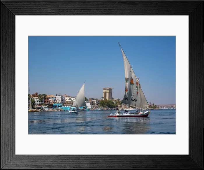 Framed Print : View of feluccas on the Nile river from small boat in Aswan, Aswan, Nubia, Egypt, North Africa, Africa Framed Print : View of feluccas on the Nile river from small boat in Aswan, Aswan, Nubia, Egypt, North Africa, Africa