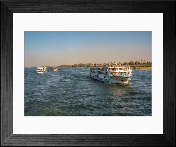 Framed Print : View of scenery and cruise boat from cruise boat near Armant on the Nile River, Luxor, Egypt, Africa Framed Print : View of scenery and cruise boat from cruise boat near Armant on the Nile River, Luxor, Egypt, Africa