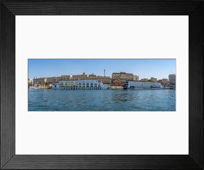 Framed Print : View of cruise boats on the Nile river from small boat in Aswan, Aswan, Nubia, Egypt, North Africa, Africa Framed Print : View of cruise boats on the Nile river from small boat in Aswan, Aswan, Nubia, Egypt, North Africa, Africa