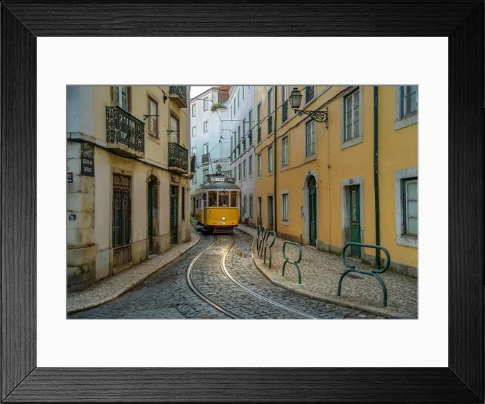 Framed Print : View of vintage tram and colourful buildings in the Alfama District on a sunny day, Lisbon, Portugal, Europe Framed Print : View of vintage tram and colourful buildings in the Alfama District on a sunny day, Lisbon, Portugal, Europe