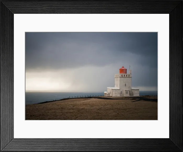 Framed Print : The lighthouse of Dyrholaey on a stormy day, southern coast of Iceland, Polar Regions