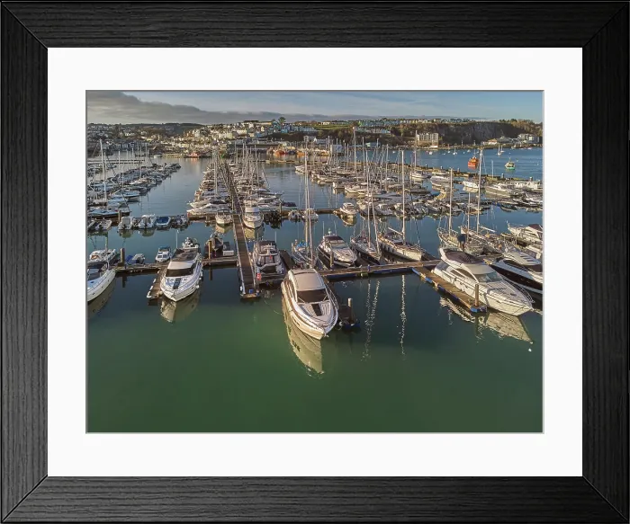 Framed Print : An aerial drone view of boats moored in the marina at Brixham, in Torbay, Devon, Great Britain Framed Print : An aerial drone view of boats moored in the marina at Brixham, in Torbay, Devon, Great Britain