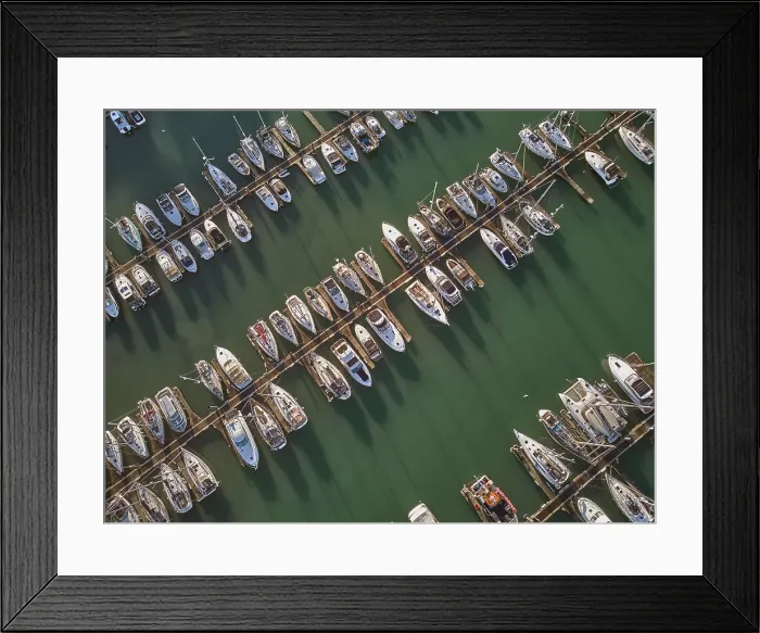 Framed Print : An aerial drone view of boats moored in the marina at Brixham, in Torbay, Devon, Great Britain