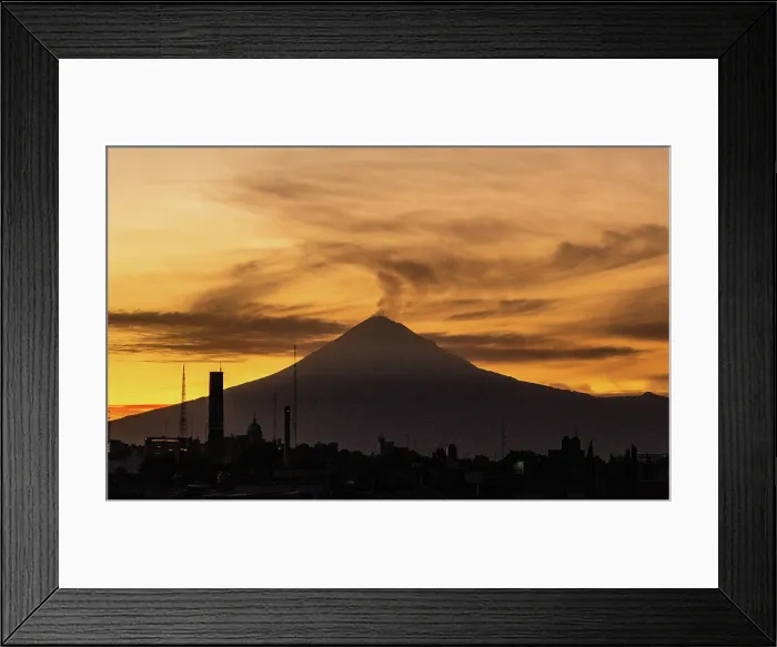 Framed Print : Views of the active Popocateptl volcano, with a plume of smoke from historical old town in Puebla, Mexico Framed Print : Views of the active Popocateptl volcano, with a plume of smoke from historical old town in Puebla, Mexico