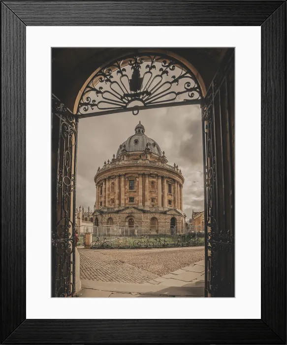 Framed Print : A vertical image of the Radcliffe Camera and Radcliffe Square framed by a metal gate in Oxford Framed Print : A vertical image of the Radcliffe Camera and Radcliffe Square framed by a metal gate in Oxford