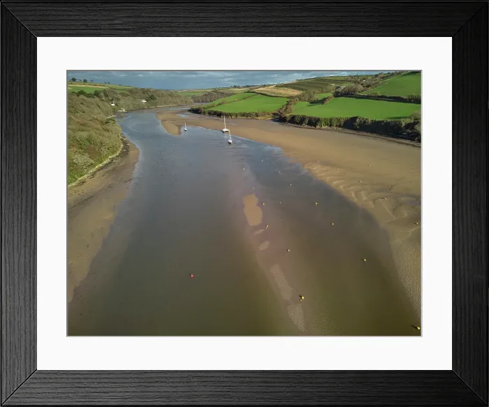 Framed Print : A low tide aerial drone view of the sandy shore and sand banks in the estuary of the River Avon, at Bantham, on the south coast of Devon, Great Britain Framed Print : A low tide aerial drone view of the sandy shore and sand banks in the estuary of the River Avon, at Bantham, on the south coast of Devon, Great Britain