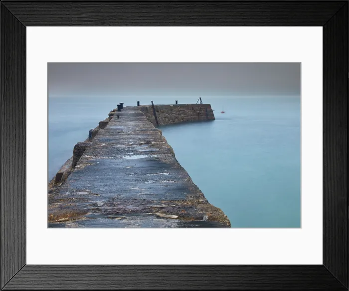 Framed Print : A misty, murky dawn view of the breakwater at Sennen Cove; on the Atlantic coast near Land's End, in the far west of Cornwall, Great Britain Framed Print : A misty, murky dawn view of the breakwater at Sennen Cove; on the Atlantic coast near Land's End, in the far west of Cornwall, Great Britain