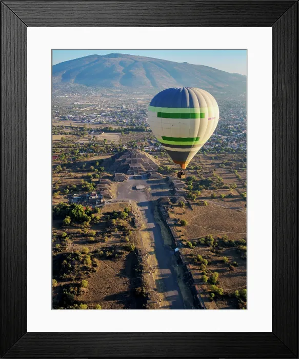 Framed Print : Hot air balloon flying over the Avenue of the Dead and the Pyramid of the Moon at sunrise, aerial view, Teotihuacan, Mexico State, Mexico Framed Print : Hot air balloon flying over the Avenue of the Dead and the Pyramid of the Moon at sunrise, aerial view, Teotihuacan, Mexico State, Mexico