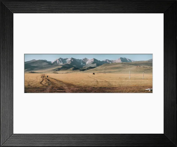 Framed Print : Panorama of the vast grasslands and rugged mountains create a breathtaking backdrop in Song Kol area during the late afternoon light Framed Print : Panorama of the vast grasslands and rugged mountains create a breathtaking backdrop in Song Kol area during the late afternoon light