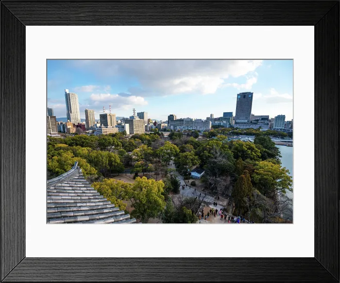 Framed Print : Skyline of Hiroshima with the area of the castle Park in the Foreground. Looking over the Samurai Castle roofs. Evening light and tree tops Framed Print : Skyline of Hiroshima with the area of the castle Park in the Foreground. Looking over the Samurai Castle roofs. Evening light and tree tops