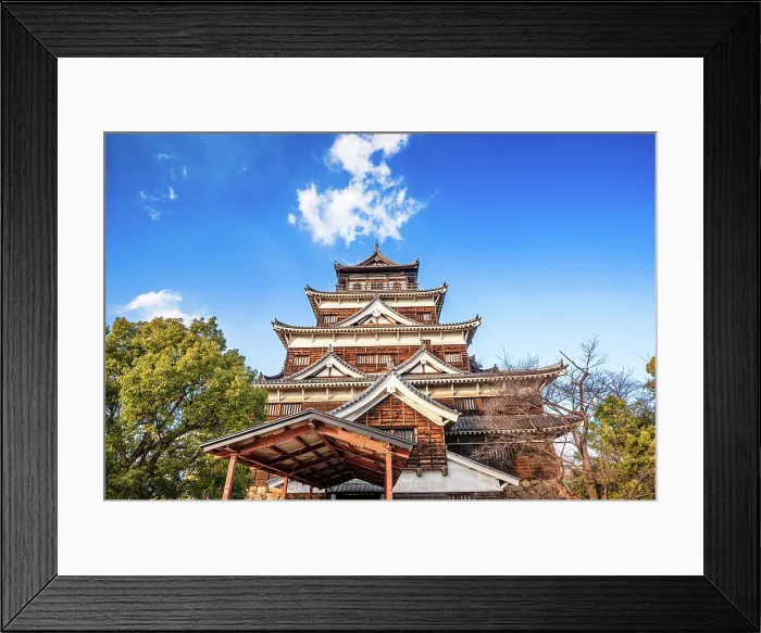 Framed Print : The Main Keep of Hiroshima Castle against a blue sky. Framed by Lush trees in the foreground. Hiroshima, Japan Framed Print : The Main Keep of Hiroshima Castle against a blue sky. Framed by Lush trees in the foreground. Hiroshima, Japan