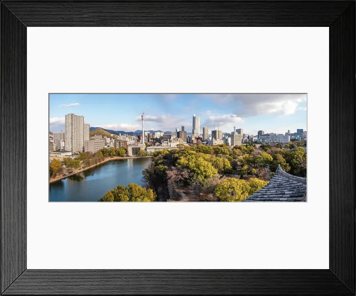 Framed Print : Skyline of Hiroshima with the area of the castle Park in the Foreground. Looking over the Samurai Castle roofs. Evening light and tree tops Framed Print : Skyline of Hiroshima with the area of the castle Park in the Foreground. Looking over the Samurai Castle roofs. Evening light and tree tops