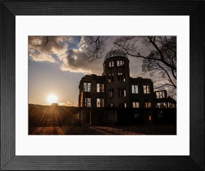 Framed Print : Dramatic sunset behind the The Hiroshima Peace Memorial (Genbaku Dome). Sunbeams on the horizon. Hiroshima, Japan Framed Print : Dramatic sunset behind the The Hiroshima Peace Memorial (Genbaku Dome). Sunbeams on the horizon. Hiroshima, Japan