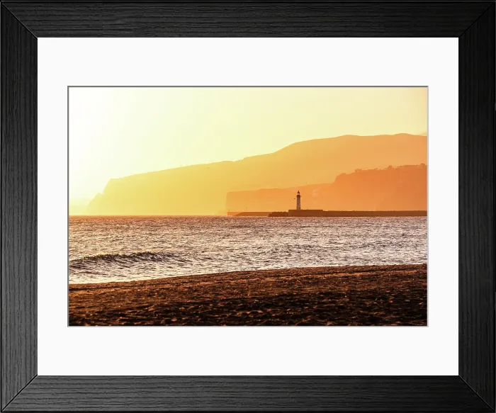 Framed Print : Beautiful orange hazy sunset in Almeria, Andalusia, Spain. Seascape hills of the Sierra Nevada on the shore with a light house Framed Print : Beautiful orange hazy sunset in Almeria, Andalusia, Spain. Seascape hills of the Sierra Nevada on the shore with a light house