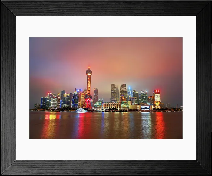 Framed Print : Brightly lit skyline of Lujiazui shrouded in fog at night, Shanghai, China. Lujiazui is the financial district of Shanghai Framed Print : Brightly lit skyline of Lujiazui shrouded in fog at night, Shanghai, China. Lujiazui is the financial district of Shanghai