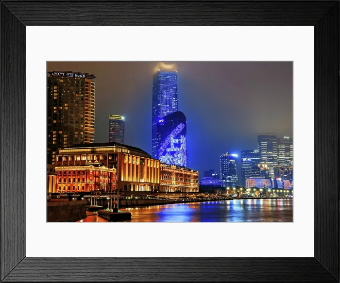 Framed Print : Brightly lit Shanghai city view at night shrouded in mist at the Bund, Shanghai, China. The low rise buildings are The Grand Halls which were previously warehouses built in 1902 Framed Print : Brightly lit Shanghai city view at night shrouded in mist at the Bund, Shanghai, China. The low rise buildings are The Grand Halls which were previously warehouses built in 1902