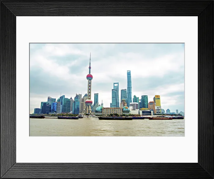 Framed Print : The iconic skyline of Lujiazui along the busy Huangpu River with never ending convoy of cargo vessels, Shanghai, China