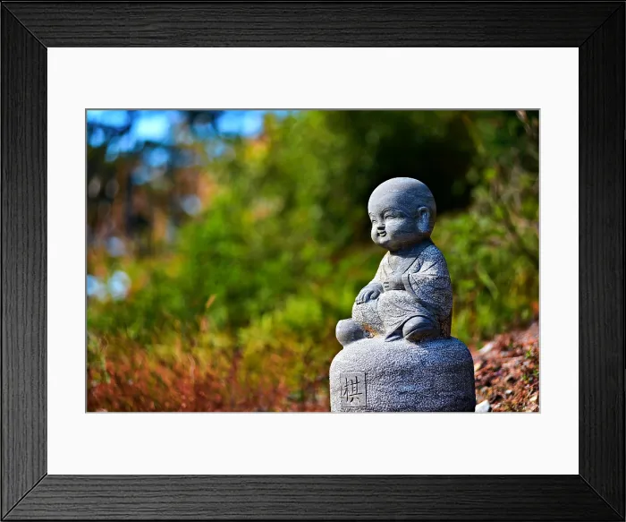 Framed Print : Adorable stone sculpture of a child monk in Nuona Pagoda Temple, aka Small Heavenly Pool Temple, a Tibetan Temple in Lushan (Mount Lu), Jiujiang City, Jiangxi, China Framed Print : Adorable stone sculpture of a child monk in Nuona Pagoda Temple, aka Small Heavenly Pool Temple, a Tibetan Temple in Lushan (Mount Lu), Jiujiang City, Jiangxi, China