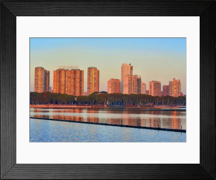 Framed Print : Cityscape of Jiujiang City at sunset over the Sai Lake, Jiangxi Province, China Framed Print : Cityscape of Jiujiang City at sunset over the Sai Lake, Jiangxi Province, China