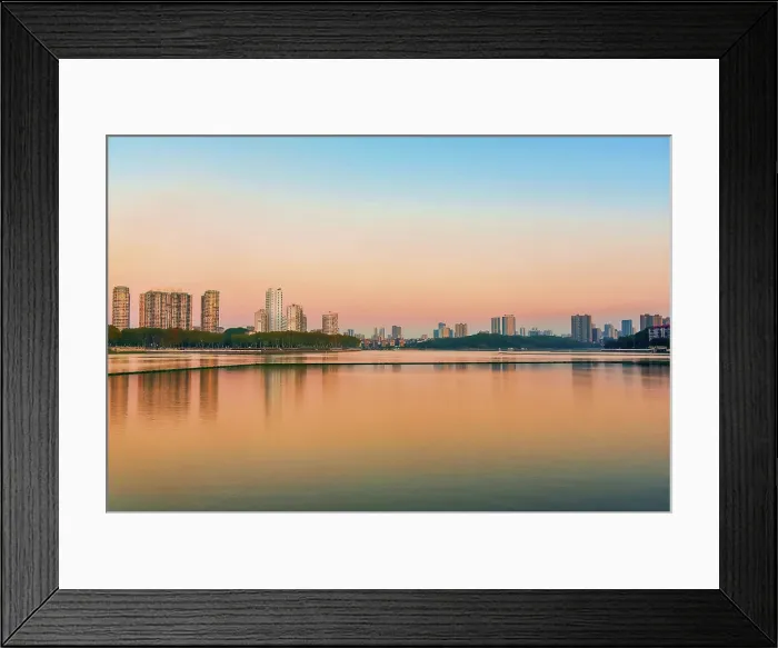 Framed Print : Cityscape of Jiujiang City at sunset over the Sai Lake, Jiangxi Province, China Framed Print : Cityscape of Jiujiang City at sunset over the Sai Lake, Jiangxi Province, China