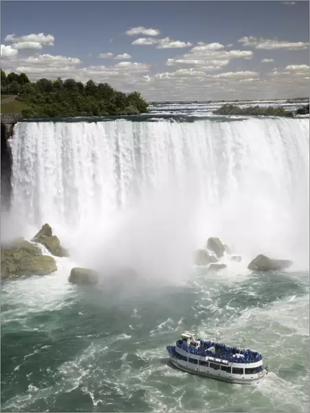 Maid of the Mist sails near the American Falls in Niagara Falls, New York State