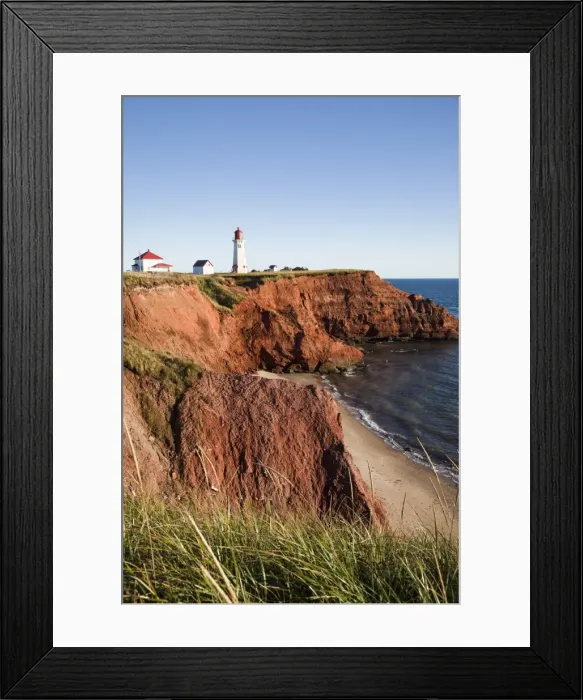 Framed Print : Lighthouse on a cliff overlooking a sandy beach on Havre-Aubert Island in the Iles de la Madeleine Framed Print : Lighthouse on a cliff overlooking a sandy beach on Havre-Aubert Island in the Iles de la Madeleine
