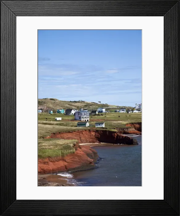Framed Print : Scalloped red sandstone cliffs with houses perched on the top on the island of Havre-Aubert Framed Print : Scalloped red sandstone cliffs with houses perched on the top on the island of Havre-Aubert
