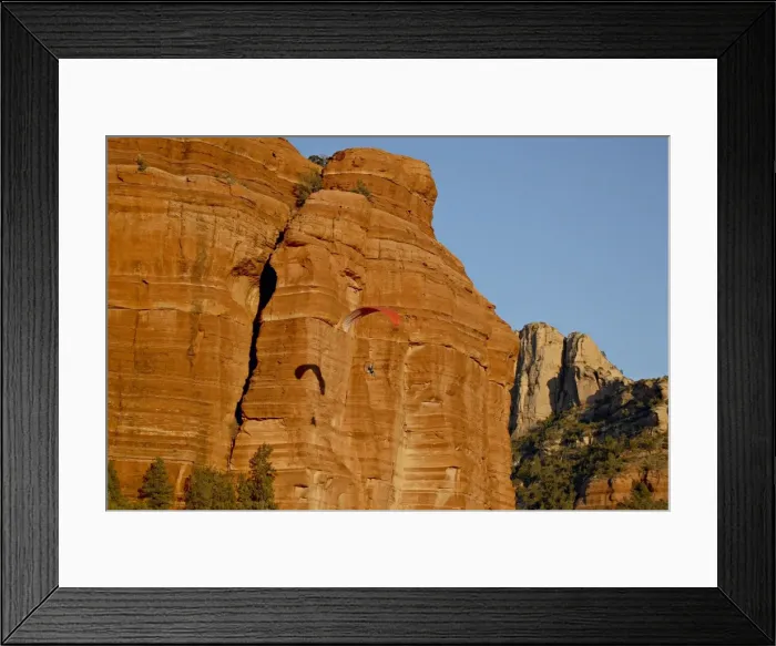 Framed Print : A paraglider flies past a red rock formation, Coconino National Forest Framed Print : A paraglider flies past a red rock formation, Coconino National Forest