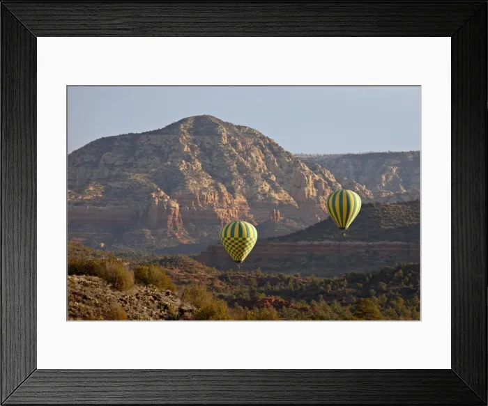 Framed Print : Two hot-air balloons flying low among red rock formations, Coconino National Forest