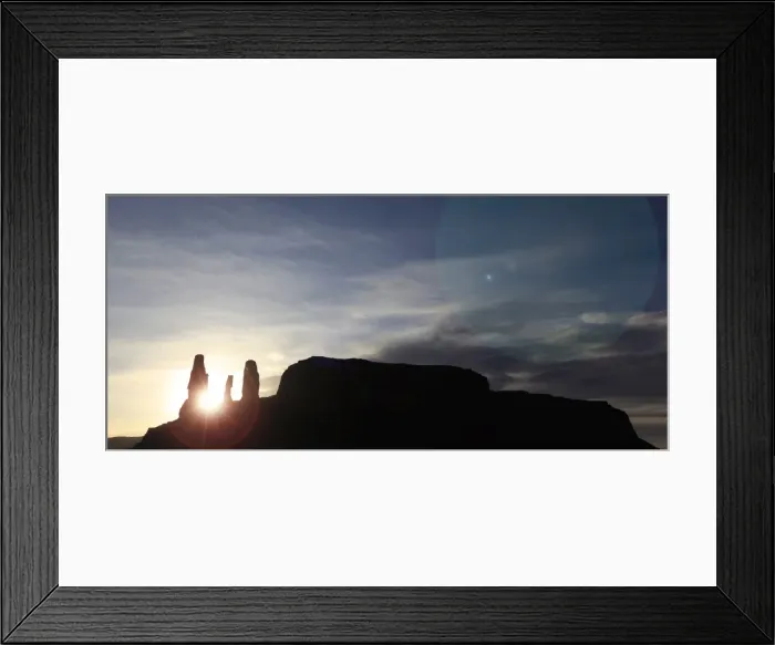 Framed Print : The evening sun sinks between a triple-monolith in the sandstone cliffs Framed Print : The evening sun sinks between a triple-monolith in the sandstone cliffs
